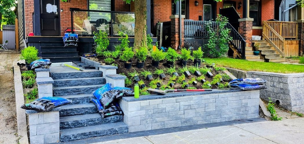 Front garden mid-build — new stone steps and retaining wall with planting still to go in