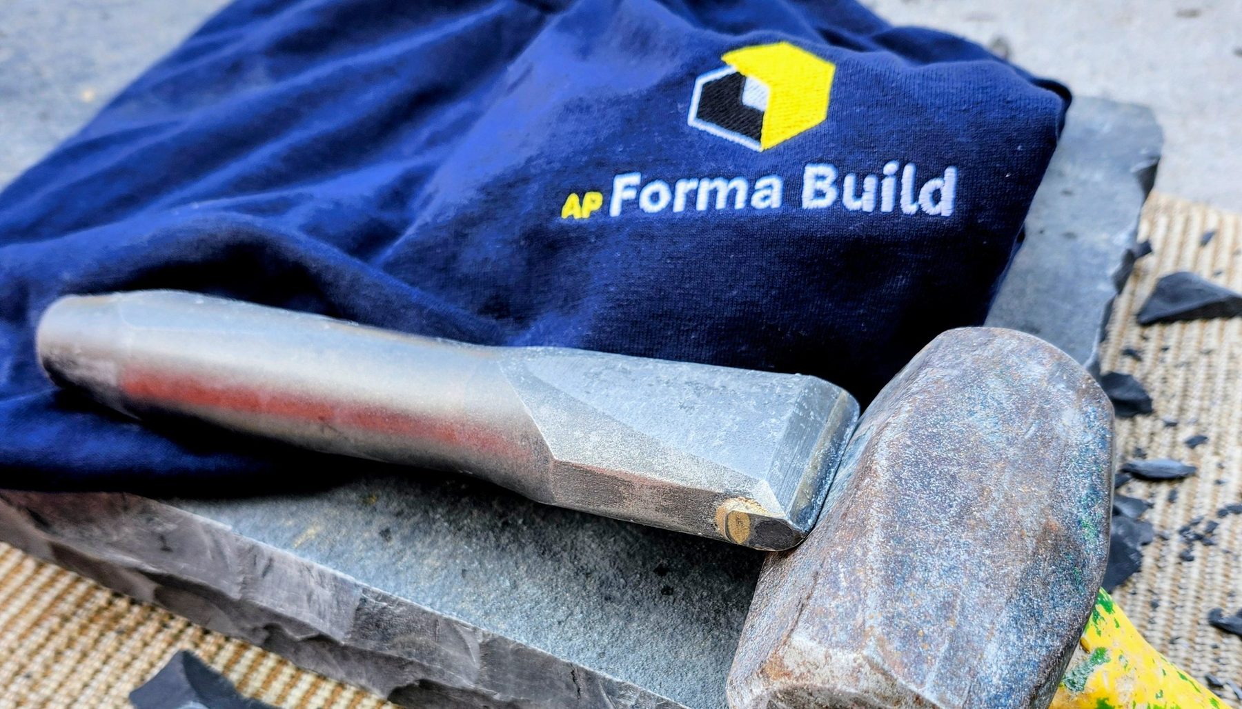 A.P Forma Build shirt with a mason’s hammer and split stone